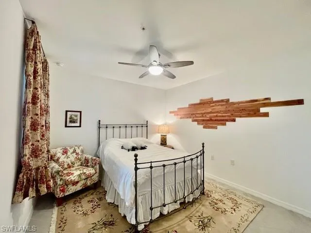 a bedroom with furniture and a window