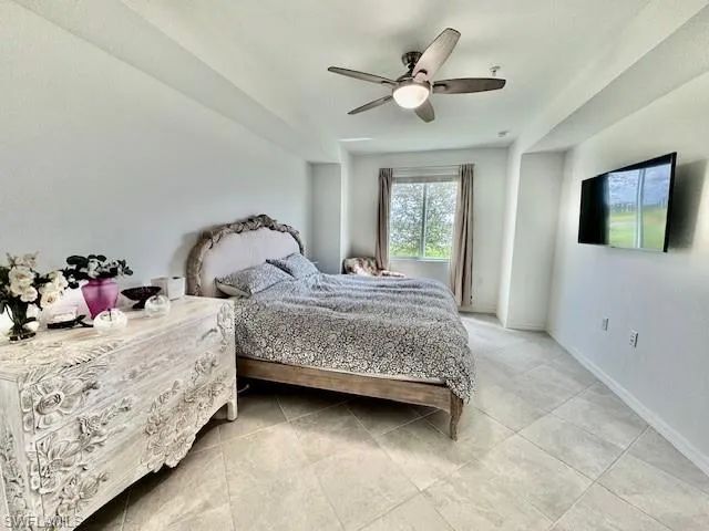 a bedroom with double bed and a window