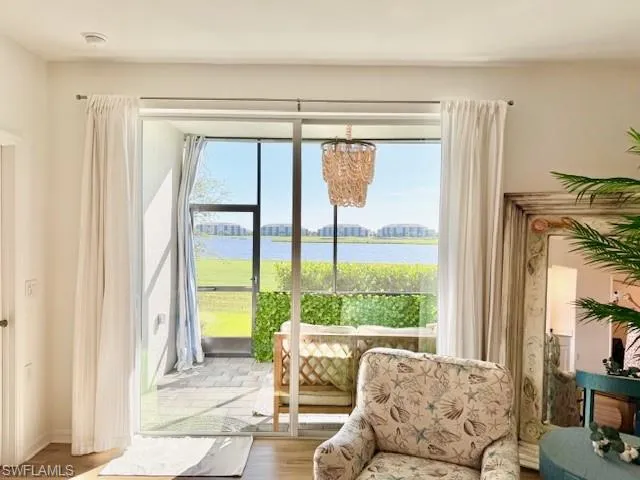 a living room filled with furniture and a window