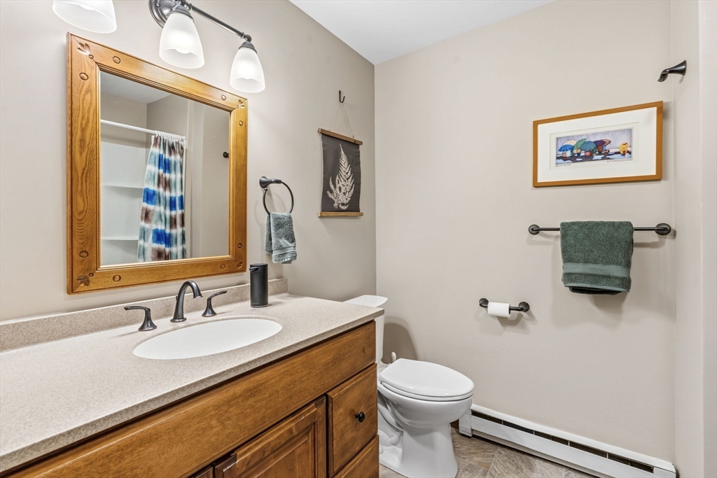 788 Burts Pit Road Northampton, MA 01062 - Photo 26 of 42 a bathroom with a granite countertop toilet sink and mirror