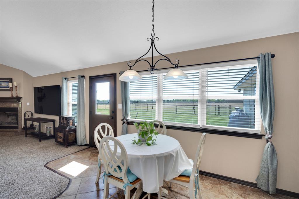 130 Eubanks Road Maypearl, TX 76064 - Photo 23 of 39 a dining room with furniture window and outside view