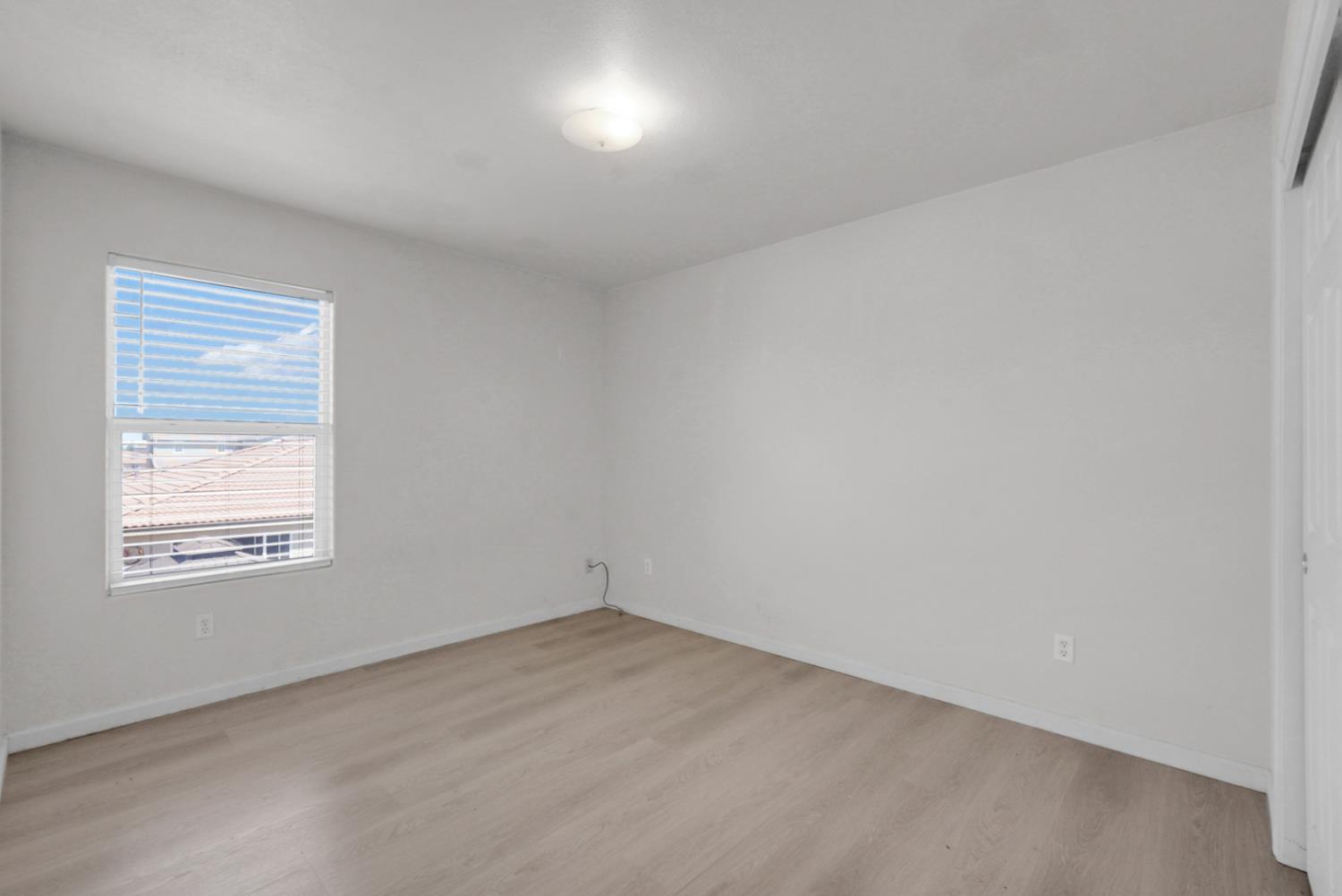 1412 Red Ribbons Lane Manteca, CA 95337 - Photo 21 of 32 an empty room with a window