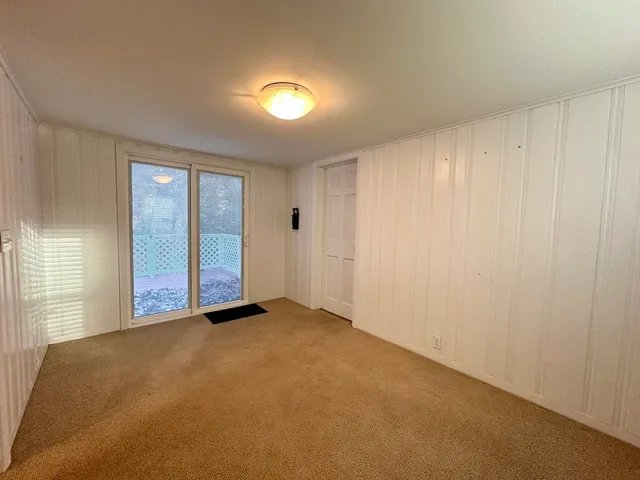 an empty room with closet area