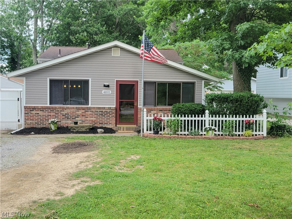 4895 Lear Nagle Road North Ridgeville, OH 44039 - Photo 1 of 27 View of front facade featuring a front lawn