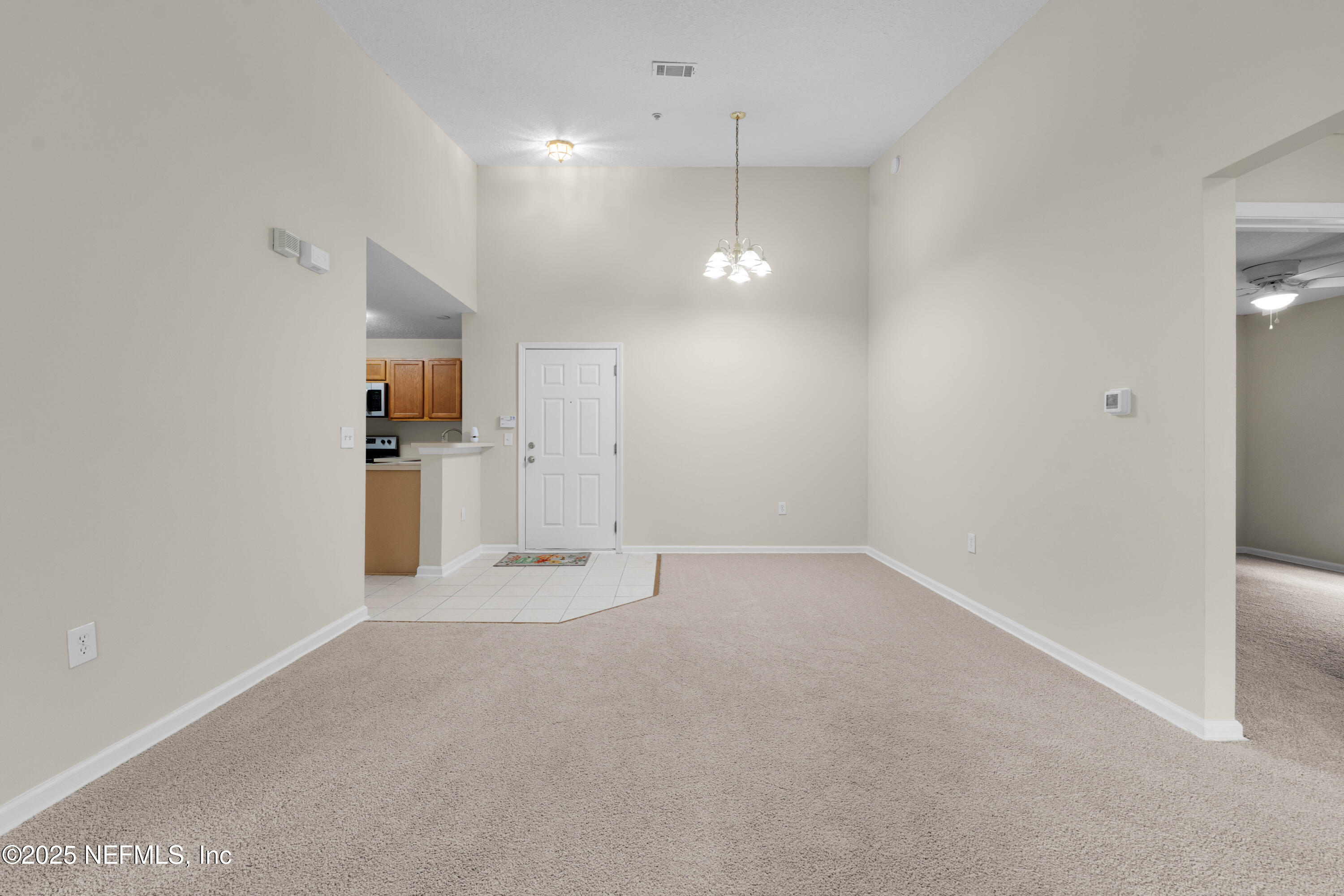 7920 Merrill Road, Unit 1116 Jacksonville, FL 32277 - Photo 11 of 27 Living / Dining Area