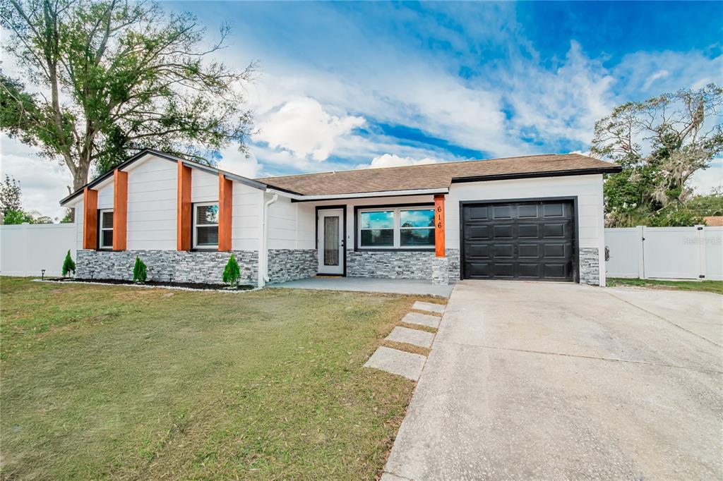 616 Highview Circle North Brandon, FL 33510 - Photo 1 of 41 front view of a house with a yard