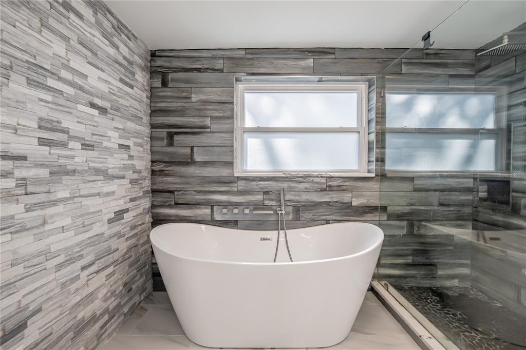 616 Highview Circle North Brandon, FL 33510 - Photo 20 of 41 a white bath tub sitting in a bathroom