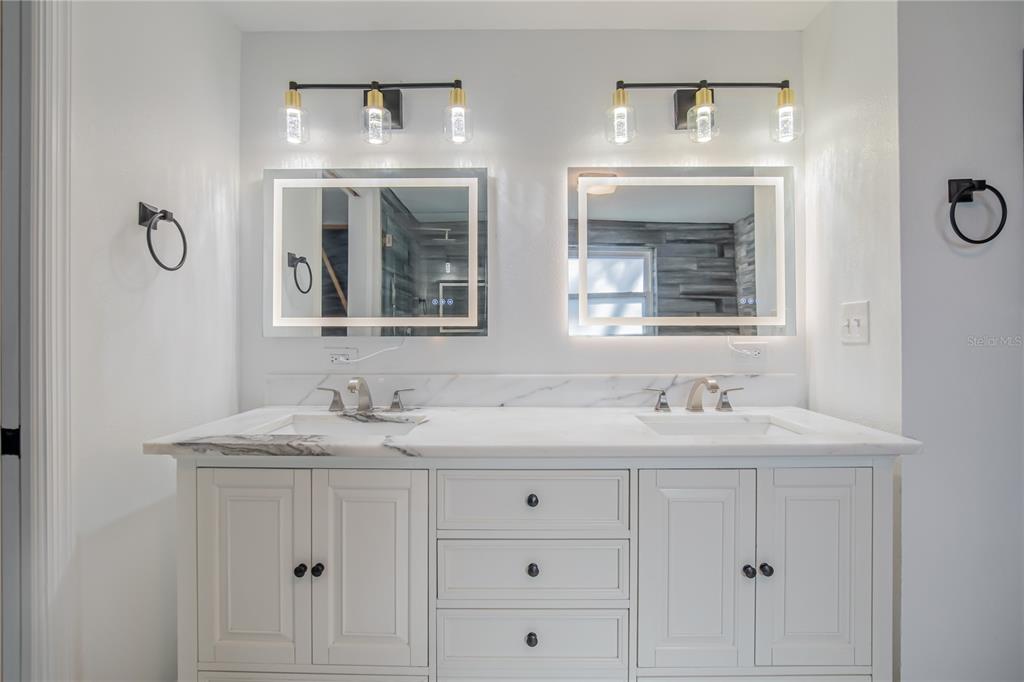 616 Highview Circle North Brandon, FL 33510 - Photo 23 of 41 a bathroom with double sink and a mirror