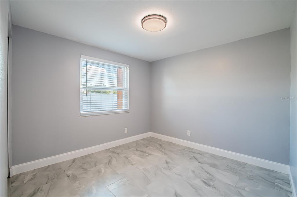 616 Highview Circle North Brandon, FL 33510 - Photo 26 of 41 an empty room with a window