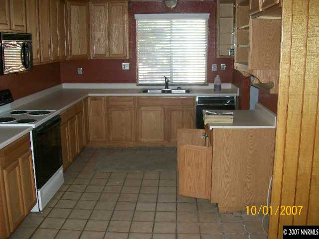 3725 Brant Street Reno, NV 89508 - Photo 2 of 3 a kitchen with a sink a stove and cabinets