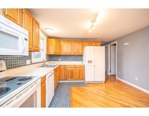 44 Corey Road Springfield, MA 01128 - Photo 12 of 29 a view of a kitchen with a sink and cabinets
