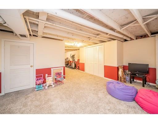 44 Corey Road Springfield, MA 01128 - Photo 18 of 29 a bedroom with furniture and a wooden floor