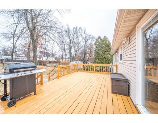 44 Corey Road Springfield, MA 01128 - Photo 23 of 29 a view of a swimming pool with wooden floor and seating space
