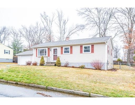 44 Corey Road Springfield, MA 01128 - Photo 3 of 29 a front view of a house with a yard and garage