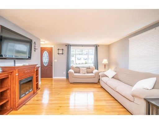 44 Corey Road Springfield, MA 01128 - Photo 6 of 29 a living room with furniture and a flat screen tv