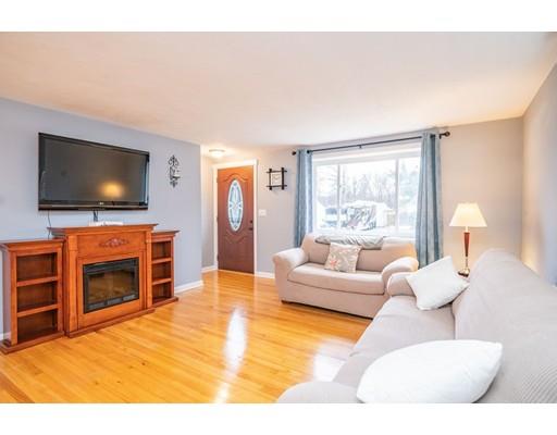 44 Corey Road Springfield, MA 01128 - Photo 7 of 29 a living room with furniture and a flat screen tv
