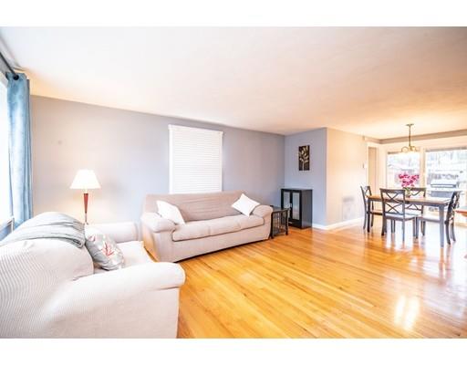 44 Corey Road Springfield, MA 01128 - Photo 8 of 29 a living room with furniture and a table