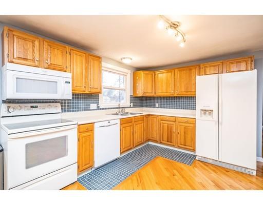 44 Corey Road Springfield, MA 01128 - Photo 10 of 29 a kitchen with a sink cabinets stainless steel appliances and a window