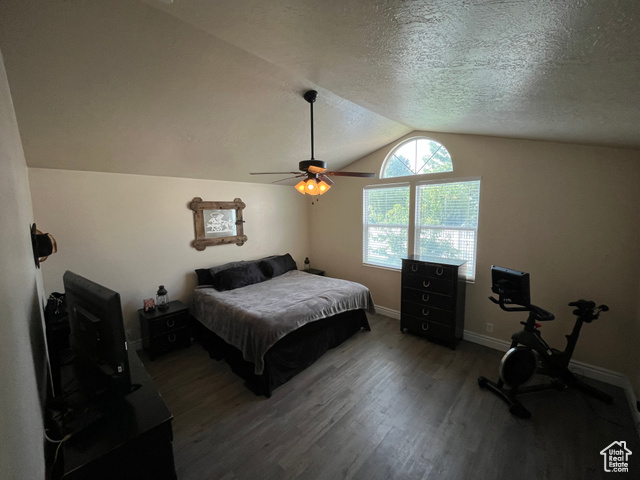 2548 South 700 West Perry, UT 84302 - Photo 6 of 18 Bedroom featuring dark wood finished floors, lofted ceiling, ceiling fan, and a textured ceiling
