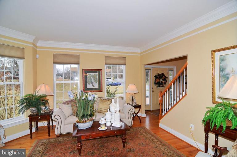 10019 German Road Ellicott City, MD 21042 - Photo 2 of 30 a living room with furniture large window and wooden floor