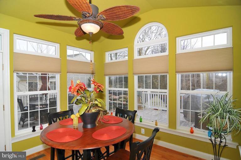 10019 German Road Ellicott City, MD 21042 - Photo 11 of 30 a view of a dining room with furniture and a potted plant