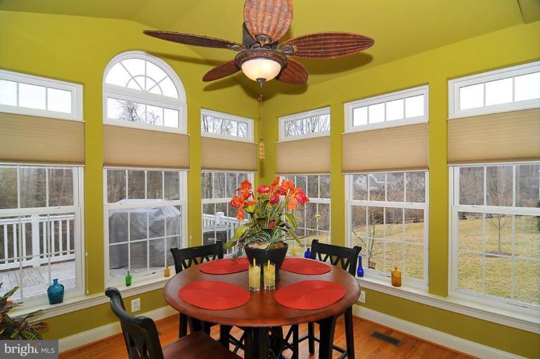 10019 German Road Ellicott City, MD 21042 - Photo 12 of 30 a view of a dining room with furniture and a chandelier