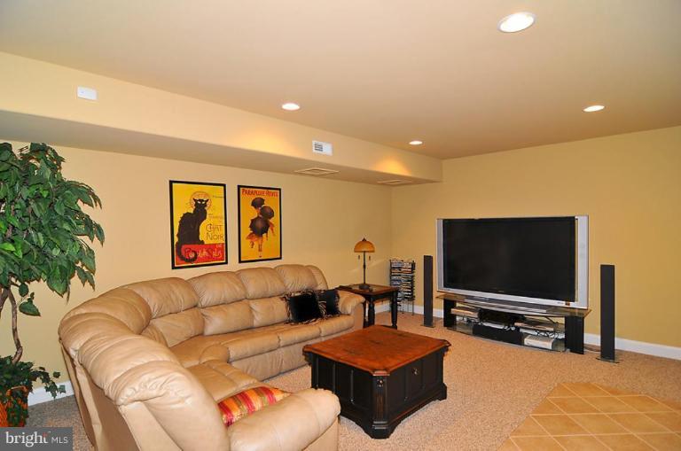 10019 German Road Ellicott City, MD 21042 - Photo 16 of 30 a living room with furniture and a flat screen tv