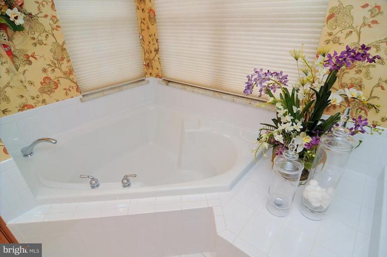 10019 German Road Ellicott City, MD 21042 - Photo 27 of 30 a white bath tub sitting in a bathroom