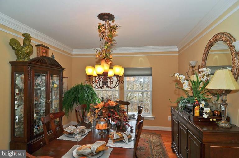 10019 German Road Ellicott City, MD 21042 - Photo 6 of 30 a view of a dining room with furniture and chandelier