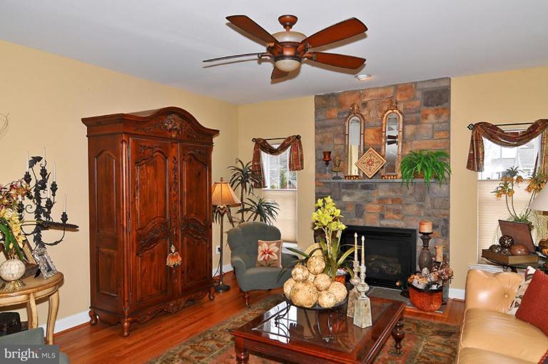 10019 German Road Ellicott City, MD 21042 - Photo 9 of 30 a living room with furniture and a fireplace
