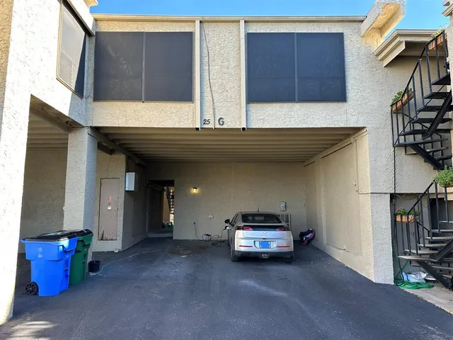 a view of a car park in front of house