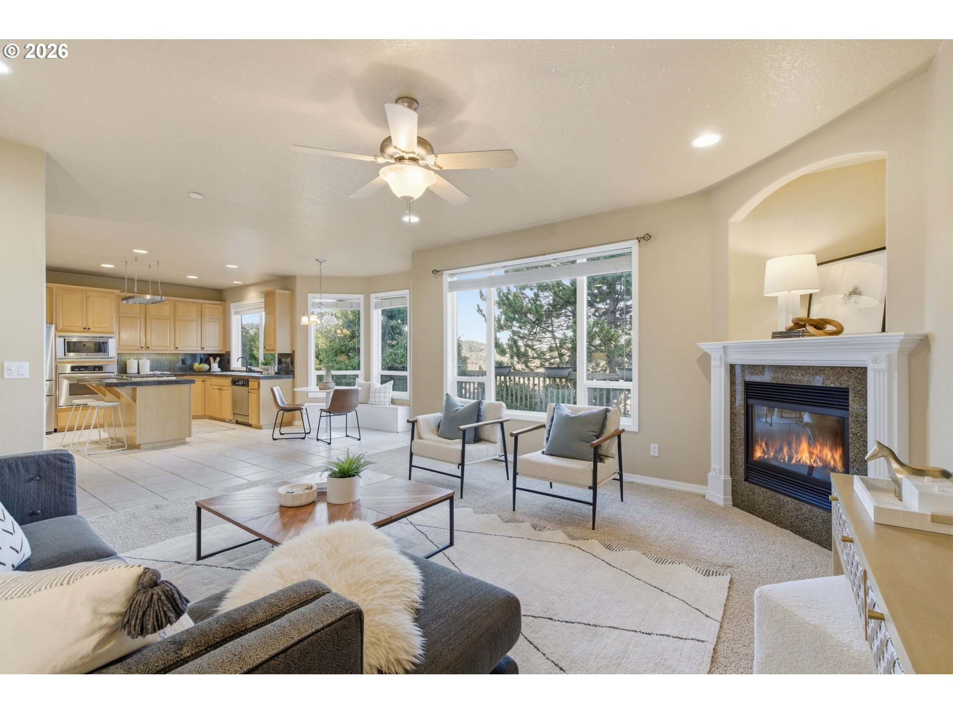 11086 Southeast Rimrock Drive Happy Valley, OR 97086 - Photo 13 of 39 a living room with furniture and a fireplace