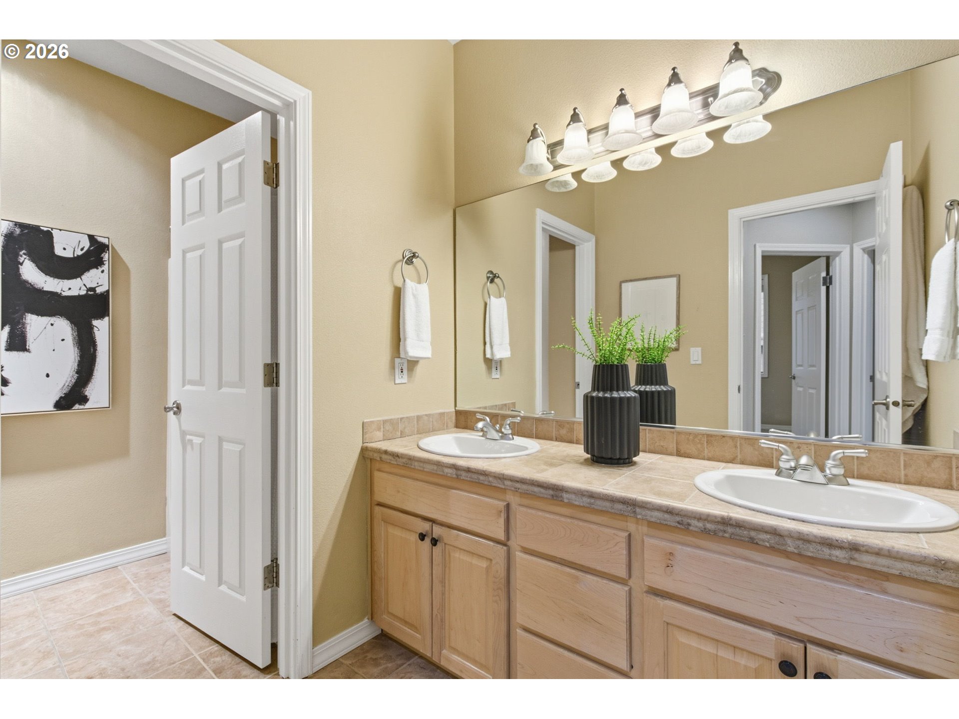 11086 Southeast Rimrock Drive Happy Valley, OR 97086 - Photo 25 of 39 a bathroom with a granite countertop sink a large mirror and a shower