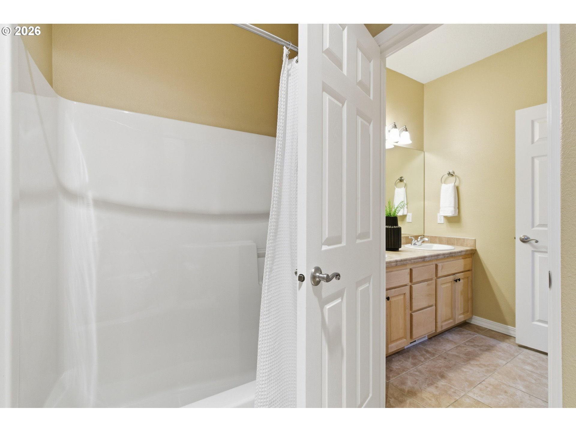 11086 Southeast Rimrock Drive Happy Valley, OR 97086 - Photo 26 of 39 a bathroom with a sink and mirror