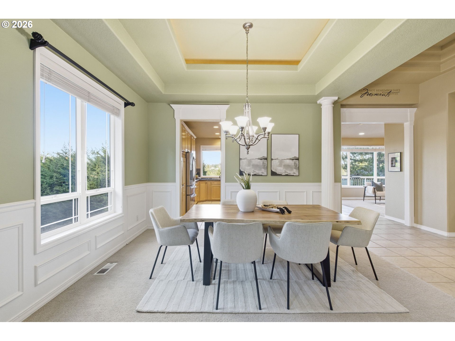 11086 Southeast Rimrock Drive Happy Valley, OR 97086 - Photo 8 of 39 a dining room with furniture a chandelier and wooden floor