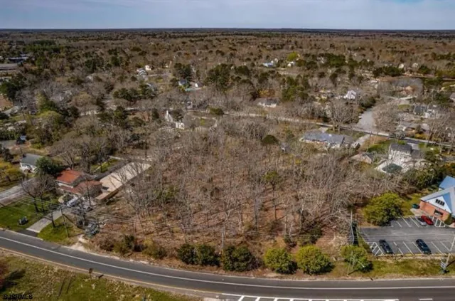 an aerial view of a residential houses with outdoor space