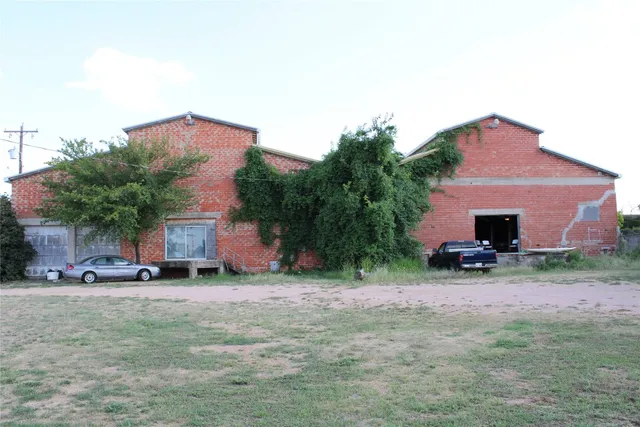 a group of people sitting in patio of a building