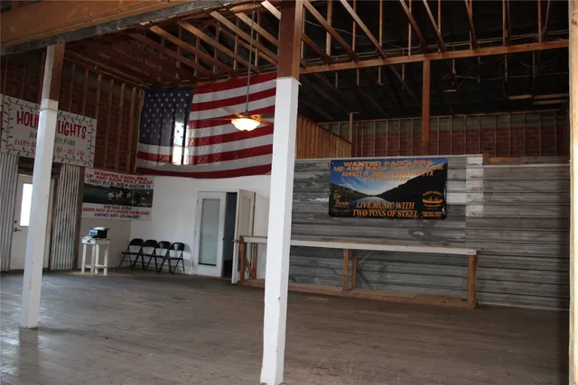 a view of a chairs and table in a patio
