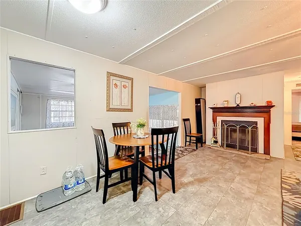 a view of a livingroom with furniture and a fireplace