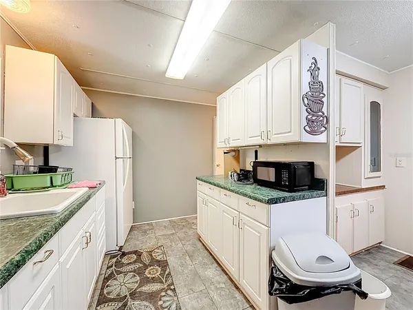 a kitchen with stainless steel appliances a stove a sink and a refrigerator