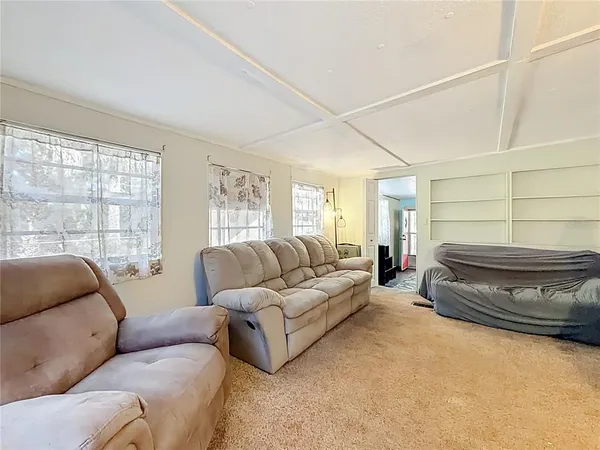 a living room with furniture and a window