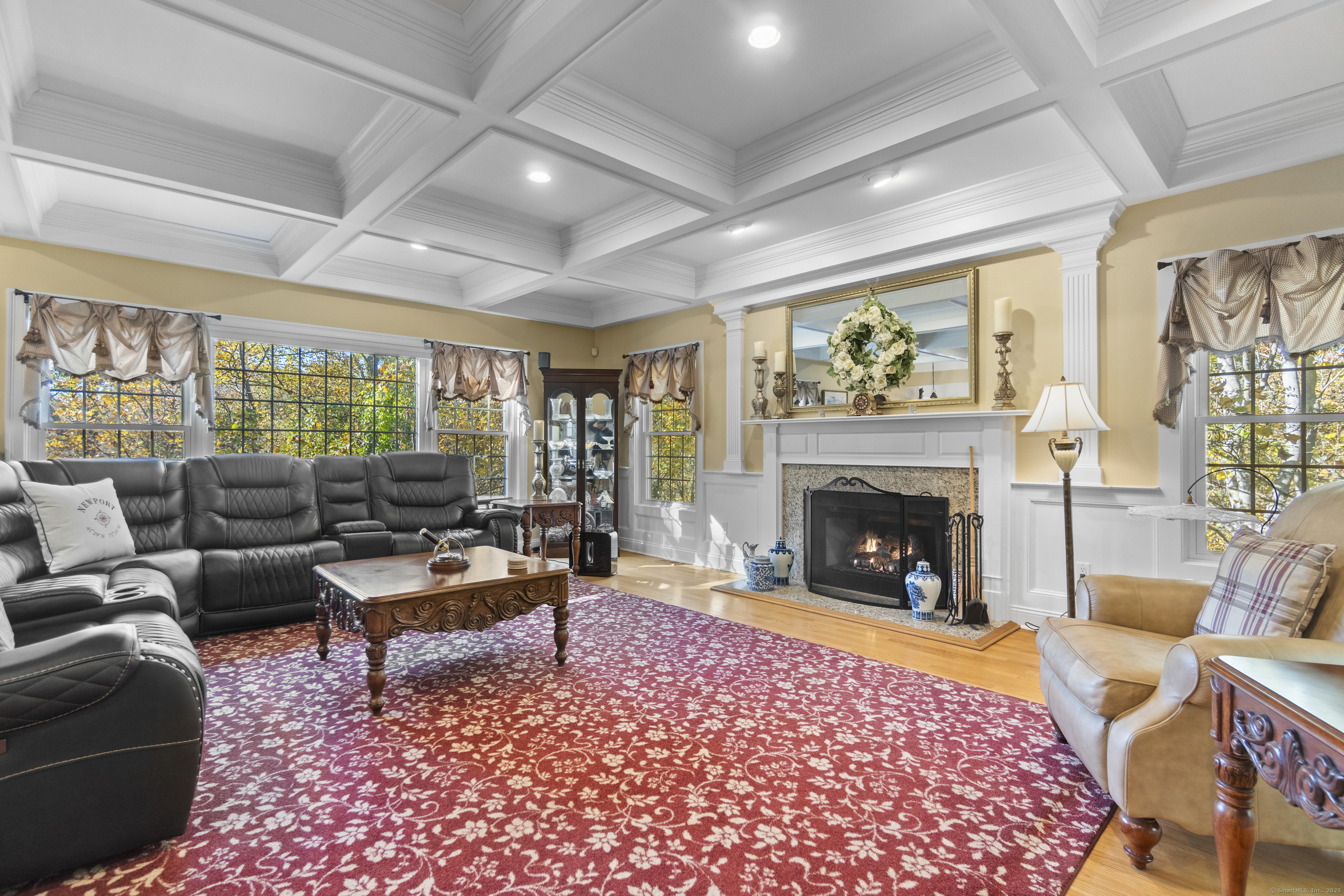38 Sportsman Hill Road Madison, CT 06443 - Photo 11 of 40 a living room with furniture and a fireplace