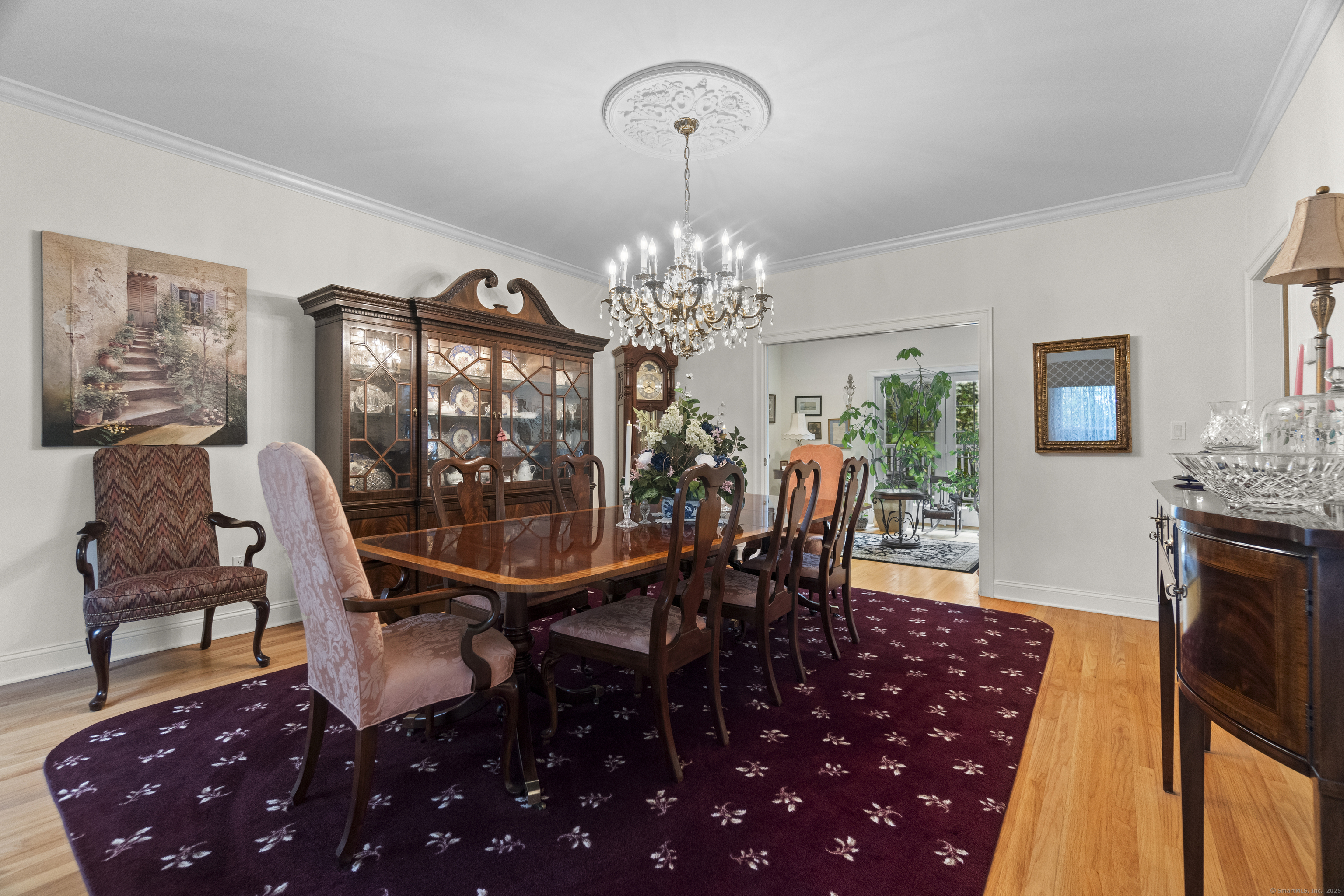 38 Sportsman Hill Road Madison, CT 06443 - Photo 13 of 40 a view of a dining room with furniture and chandelier