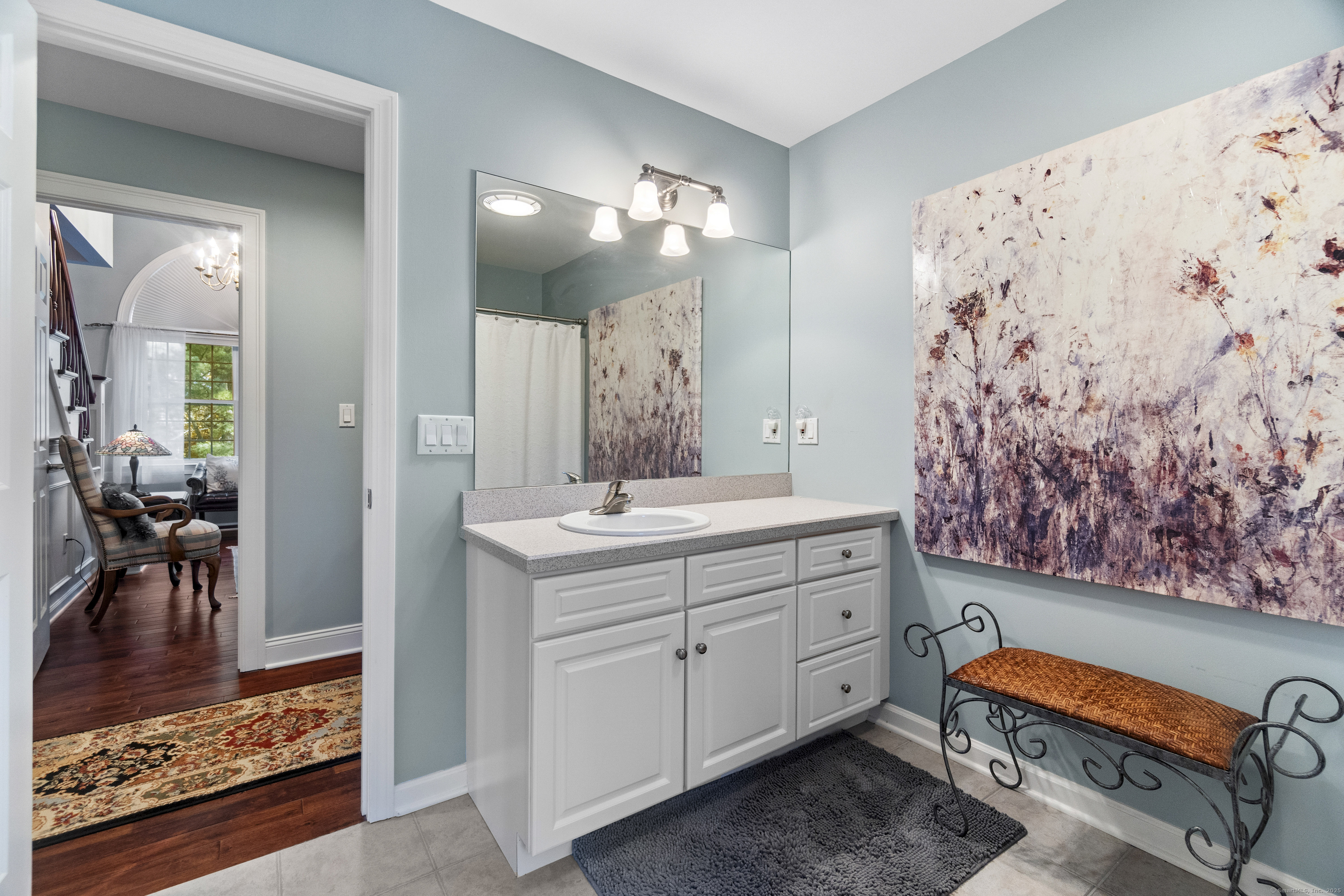 38 Sportsman Hill Road Madison, CT 06443 - Photo 24 of 40 a spacious bathroom with a double vanity sink and a mirror