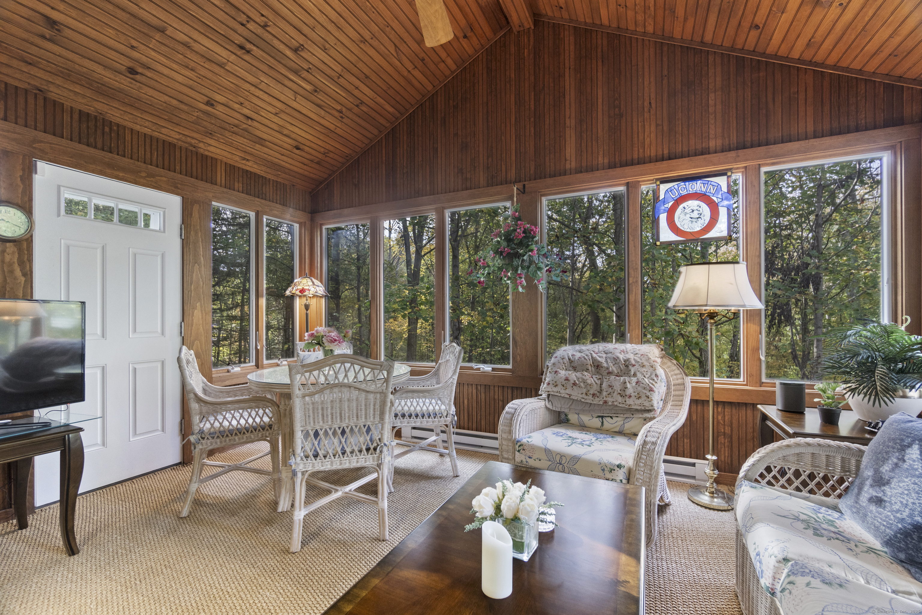 38 Sportsman Hill Road Madison, CT 06443 - Photo 26 of 40 a outdoor living space with furniture potted plant and a large window