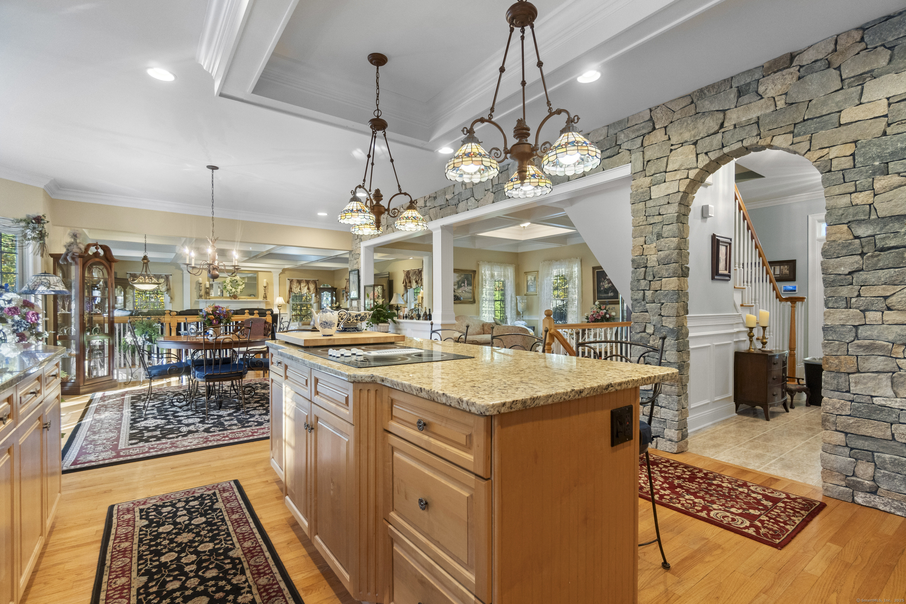 38 Sportsman Hill Road Madison, CT 06443 - Photo 3 of 40 a large kitchen with a table and chairs