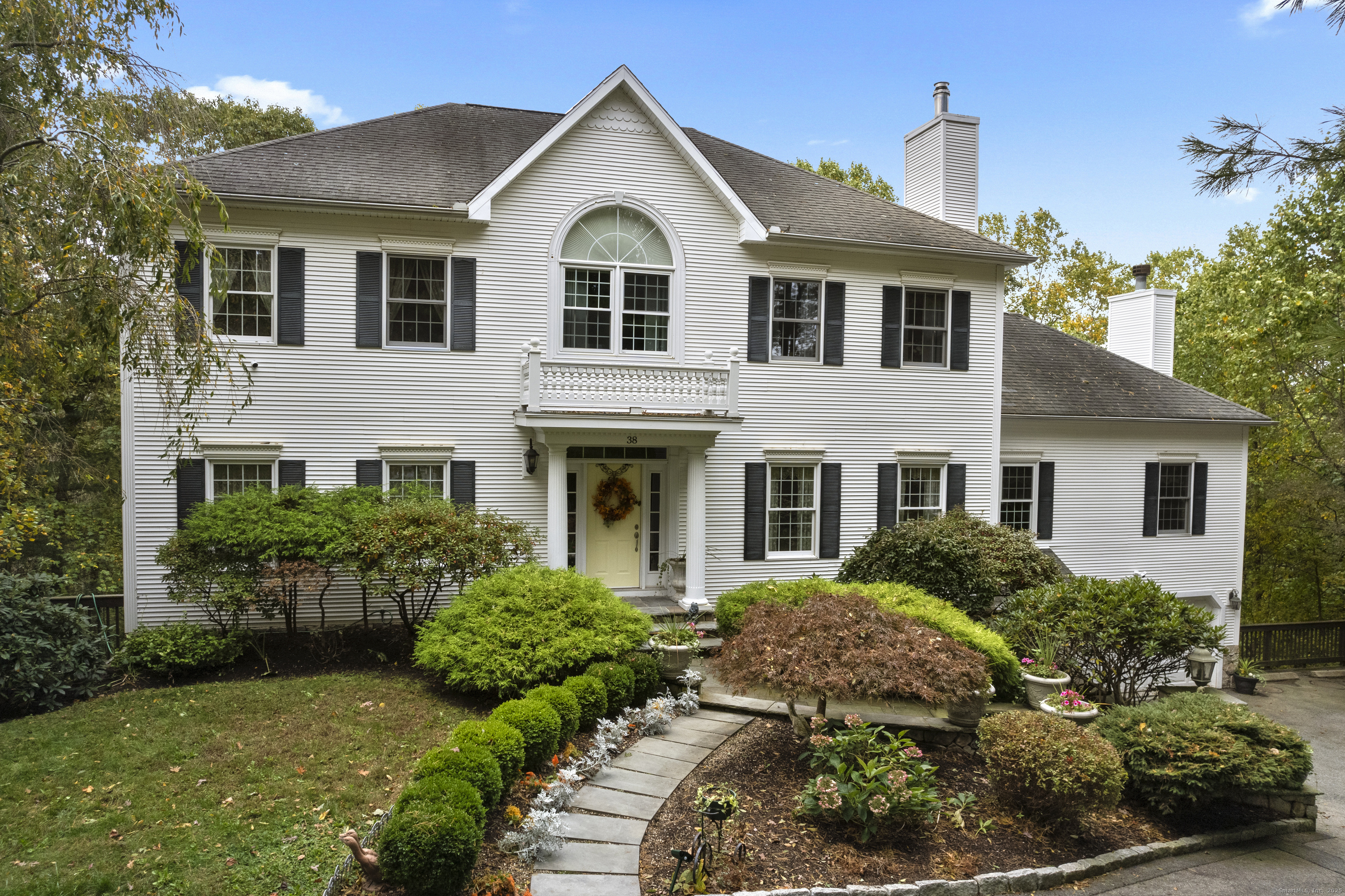 38 Sportsman Hill Road Madison, CT 06443 - Photo 40 of 40 a front view of a house with a yard