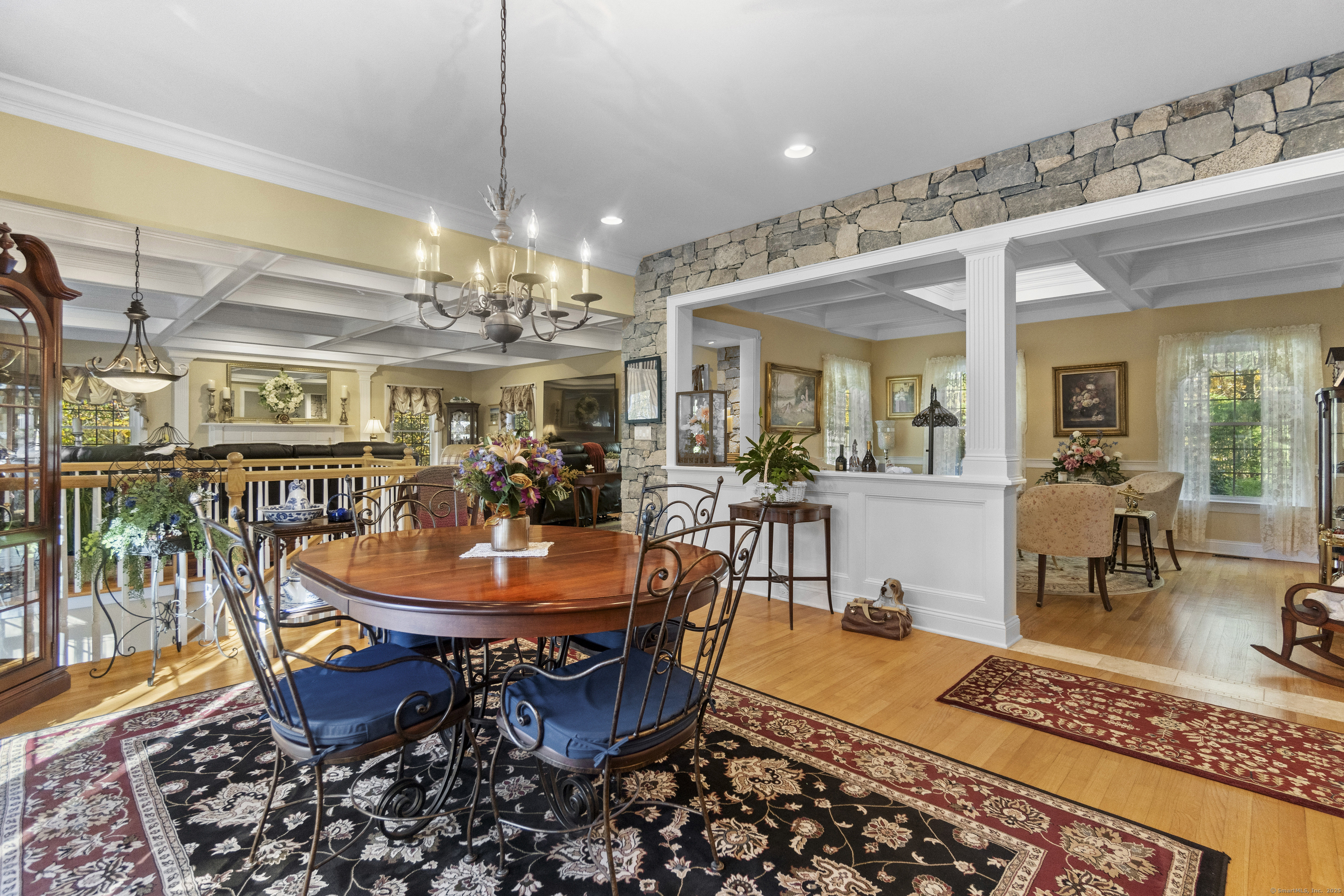 38 Sportsman Hill Road Madison, CT 06443 - Photo 7 of 40 a view of a dining room with furniture wooden floor and chandelier