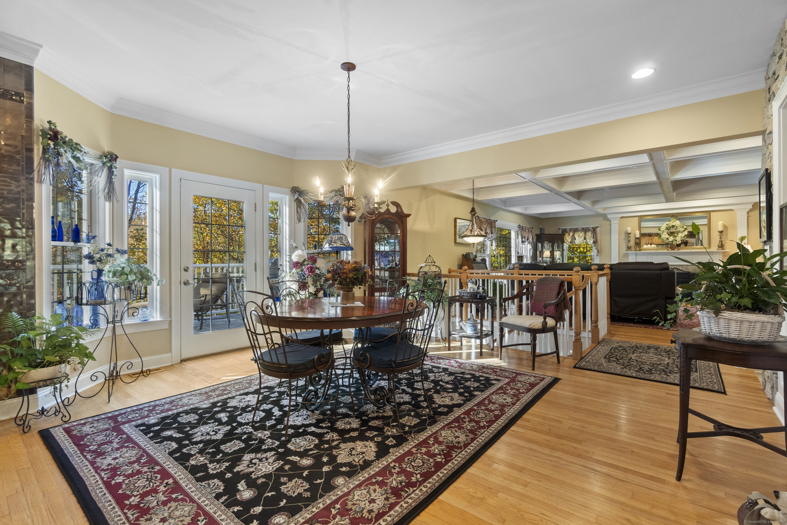 38 Sportsman Hill Road Madison, CT 06443 - Photo 8 of 40 a living room with lots of furniture and a chandelier