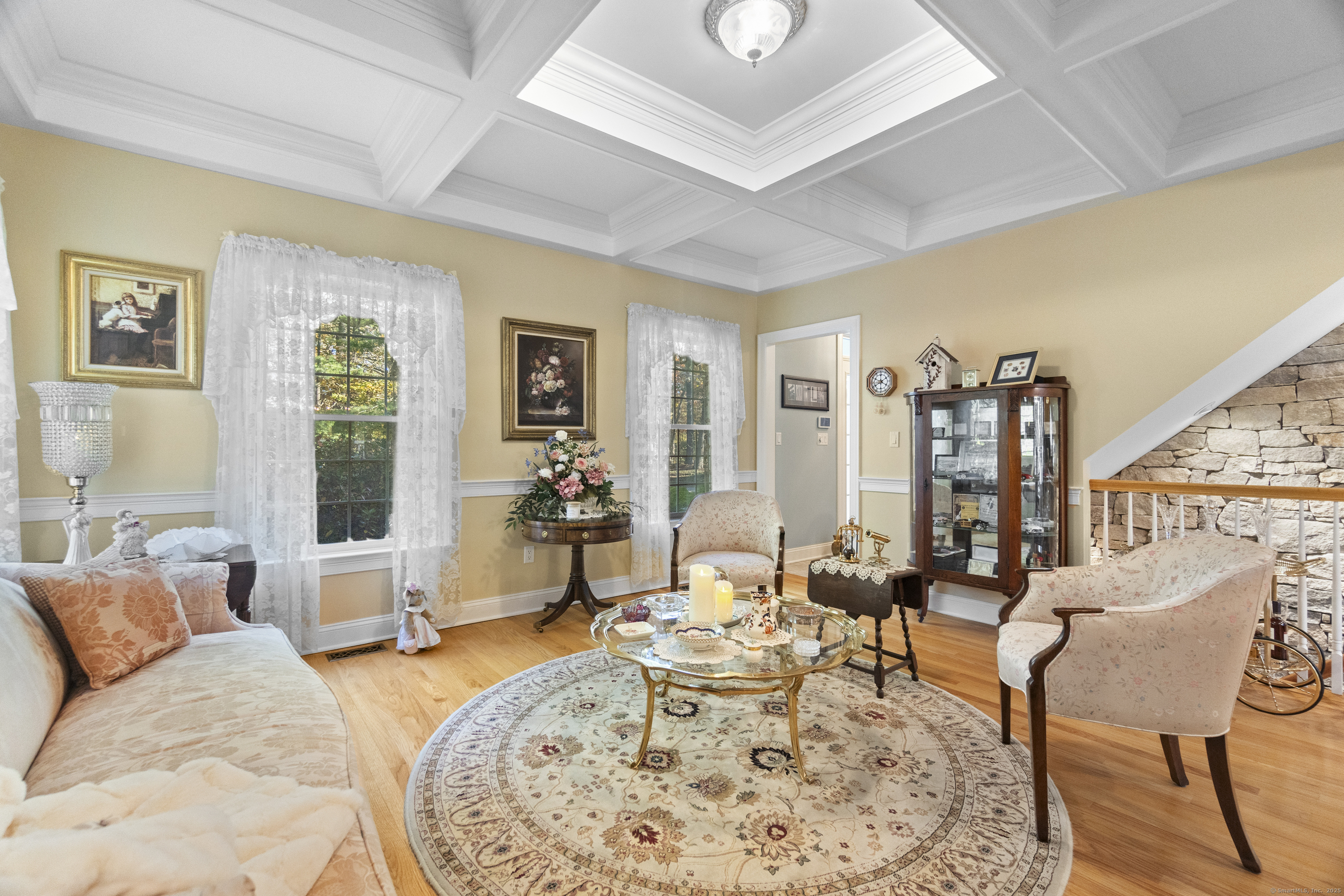 38 Sportsman Hill Road Madison, CT 06443 - Photo 9 of 40 a living room with furniture large window and wooden floor